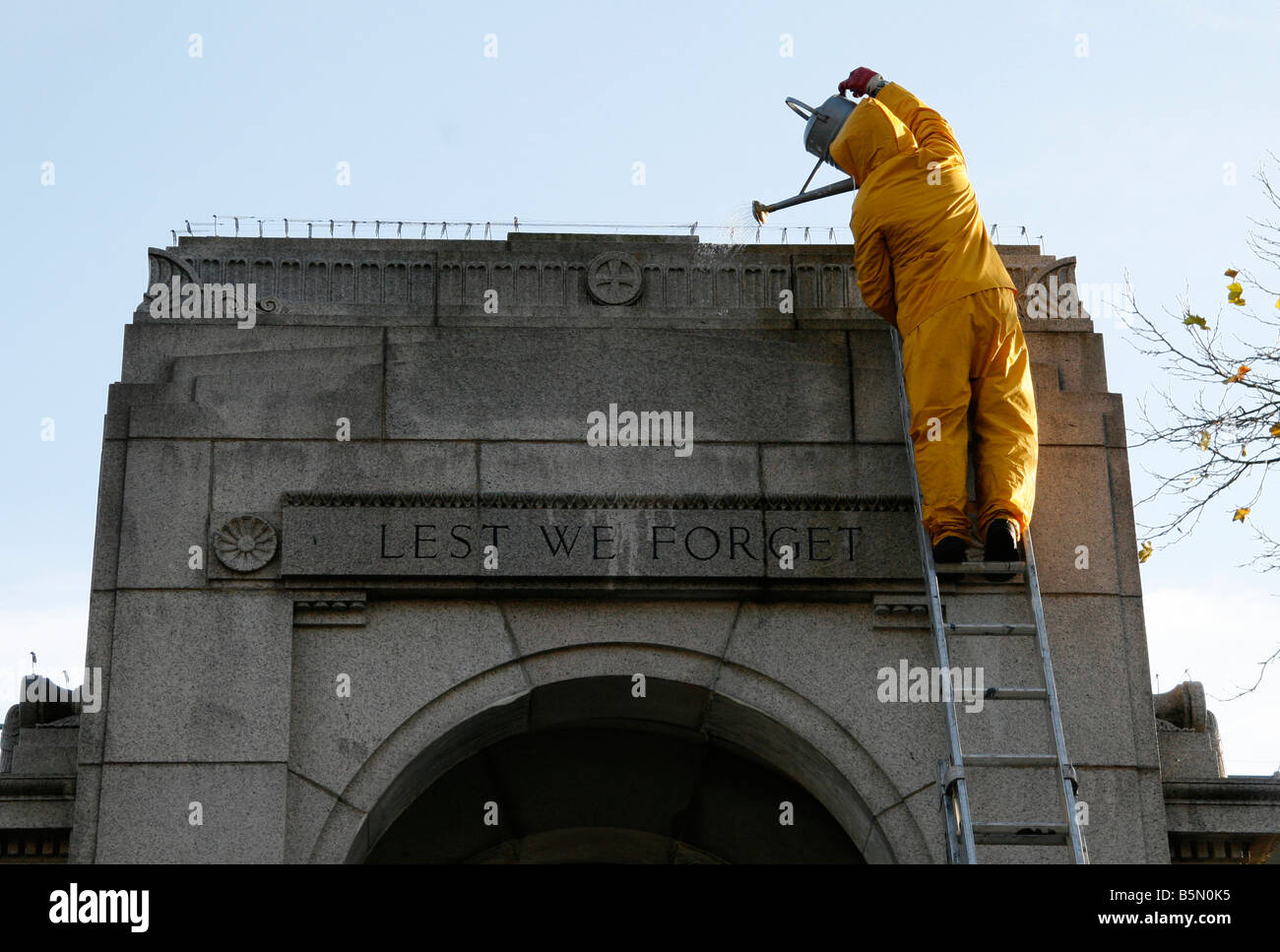 Council Worker Cleaning The Cenotaph in Bolton Lancashire UK Stock Photo