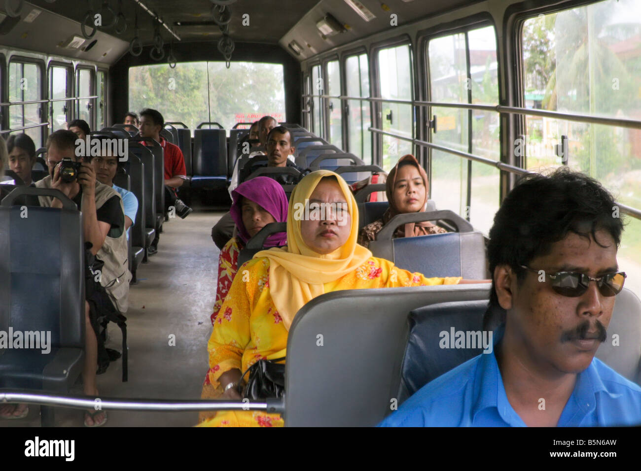 Inside a malaysian bus, view from the rearview's driver mirror