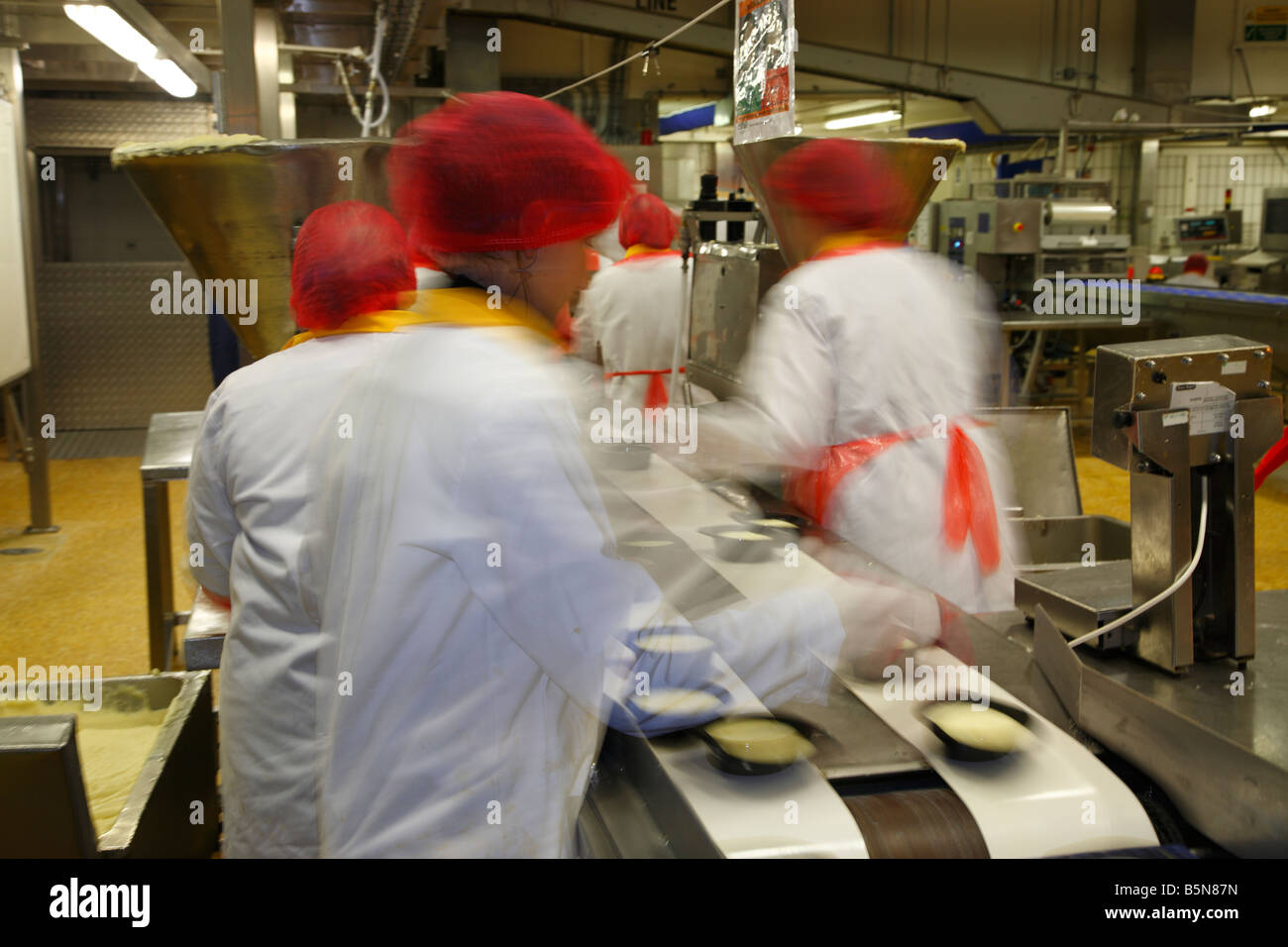 Frozen food production line workers. England ,United Kingdom. Stock Photo