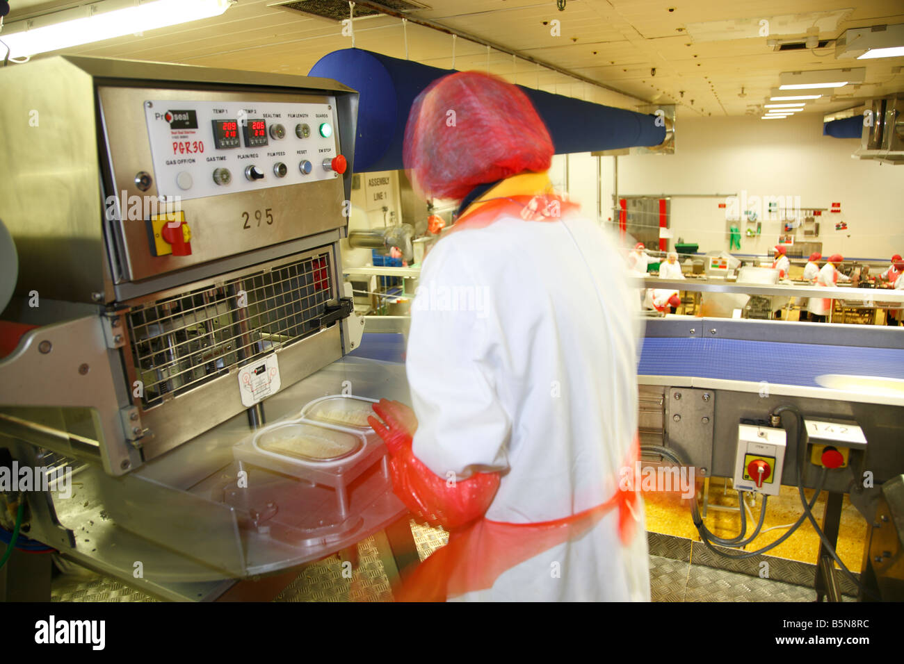Frozen food production line workers. England ,United Kingdom. Stock Photo