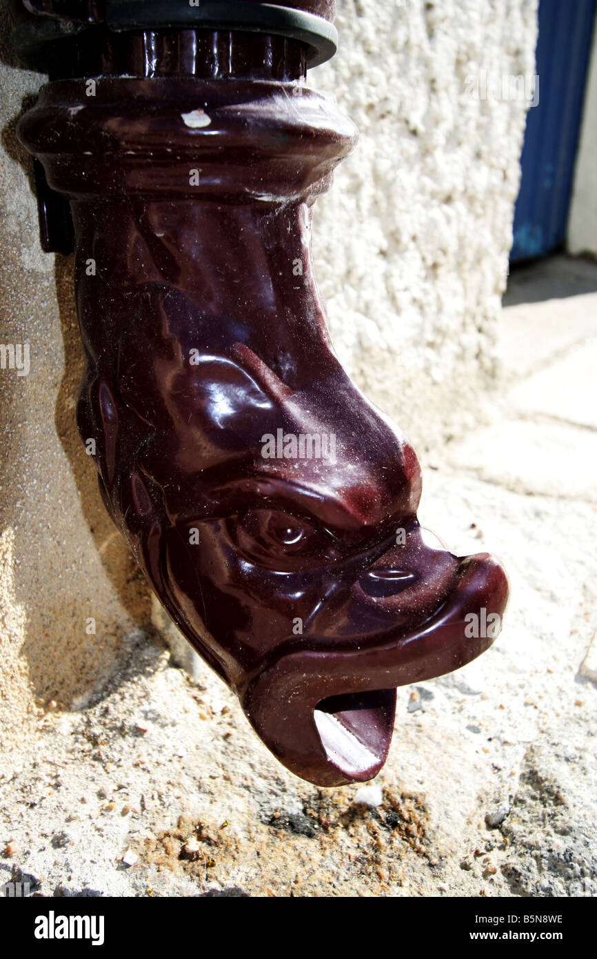 An unusual drain pipe in the shape of a fish mouth Stock Photo Alamy