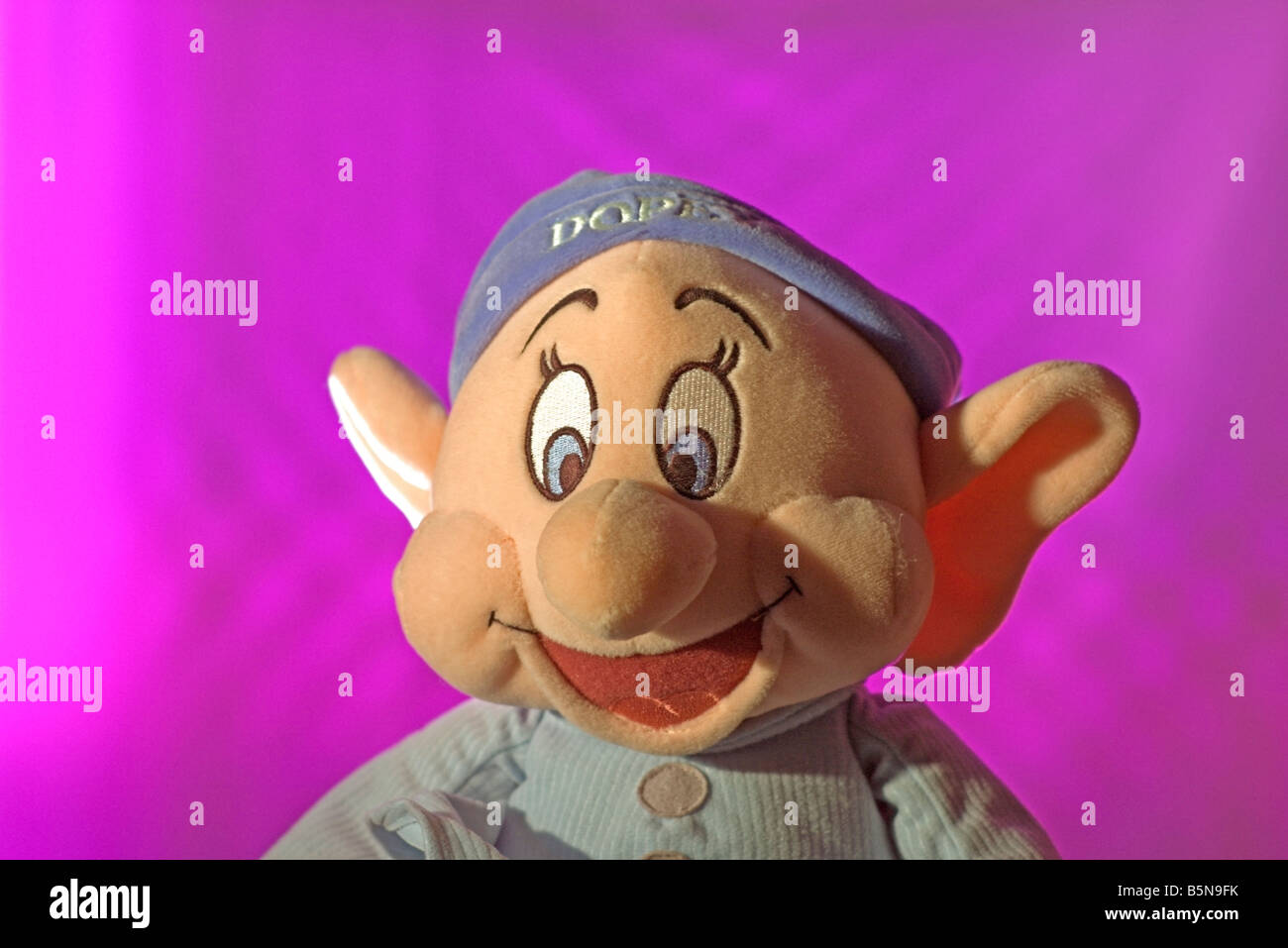 A toy of Dopey from the Seven Dwarves, lit as a portrait Stock Photo