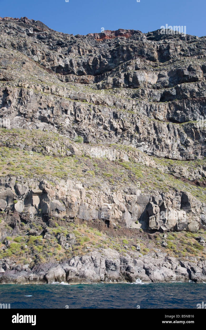 Layers of lava rock exposed in the caldera walls of Santorini Stock Photo
