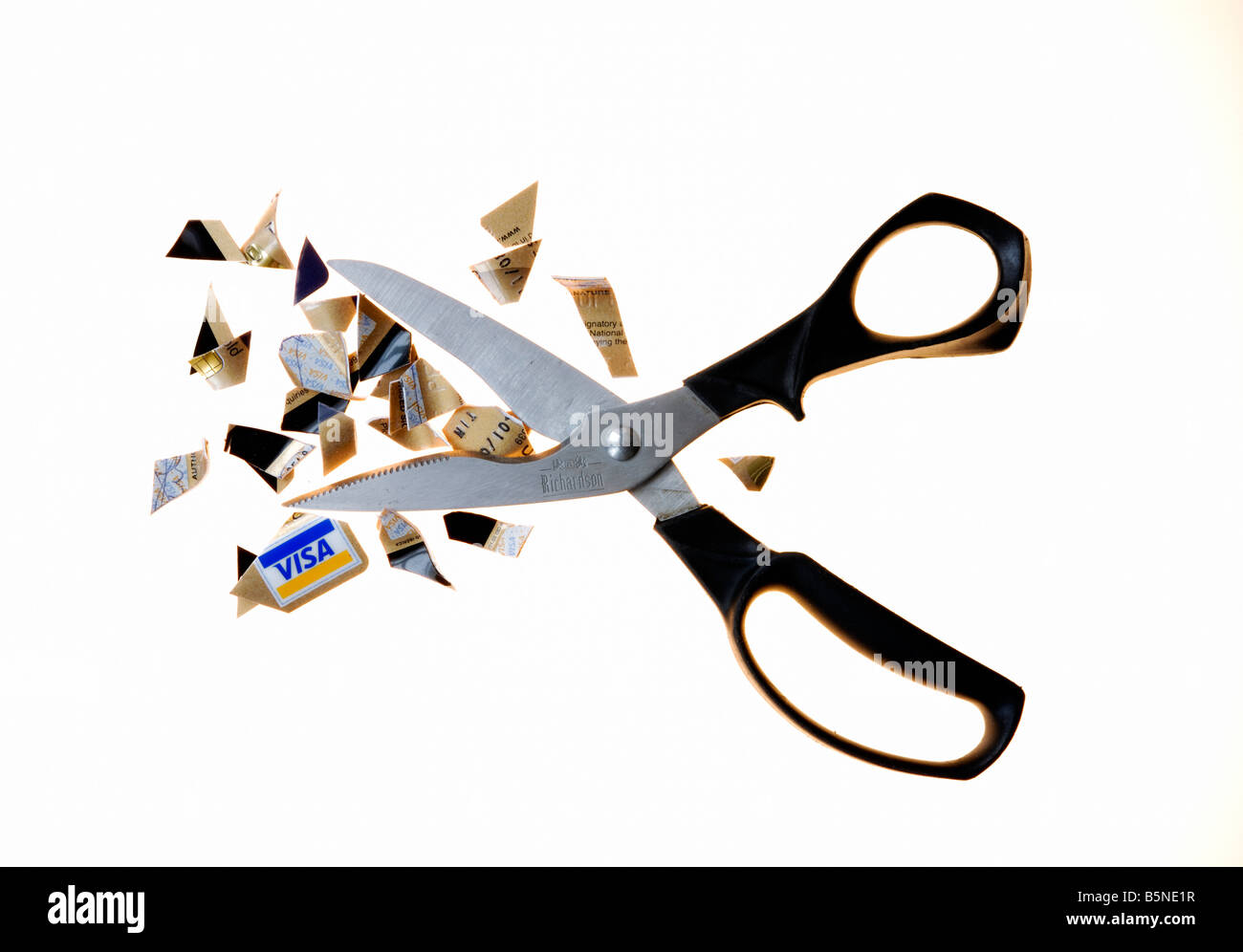 Cutting up credit card Stock Photo