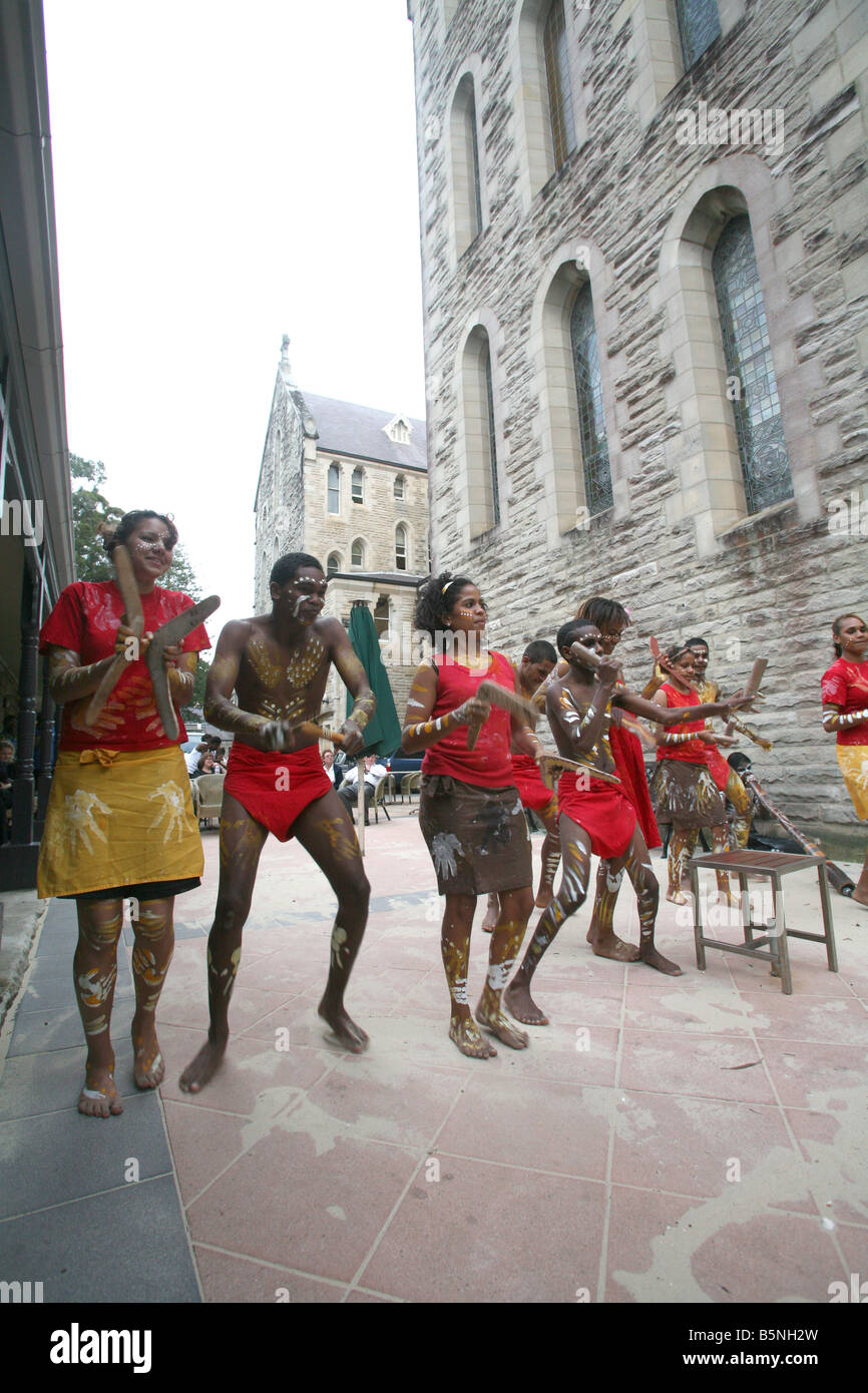 Indigenous Australian students dance during a cultural performance at the Manly International Hotel School Stock Photo