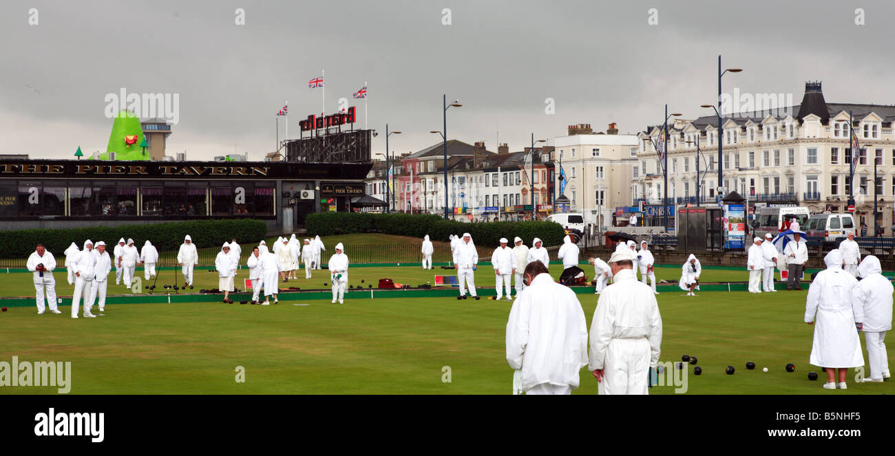 Teams of bowlers compete on the greens at Great Yarmouth Norfolk undaunted by heavy summer rain July 17 2008 Stock Photo