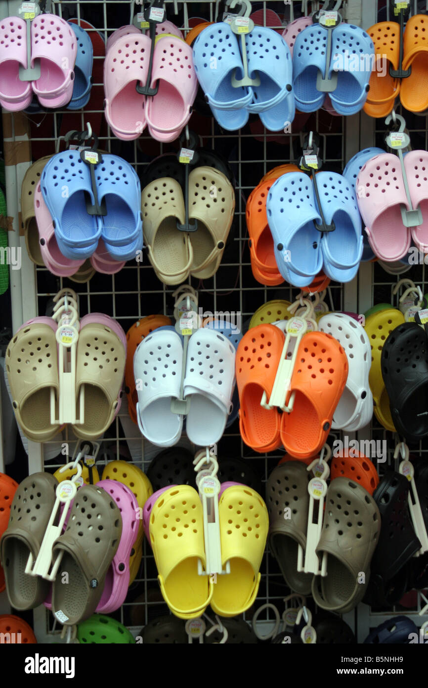 coloured shoes on a shoe rack Stock Photo - Alamy