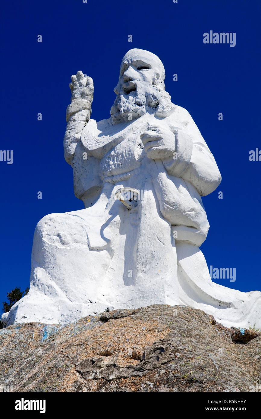 Statue of Neptune on top of Aquarium built into rocks at Tregastel on