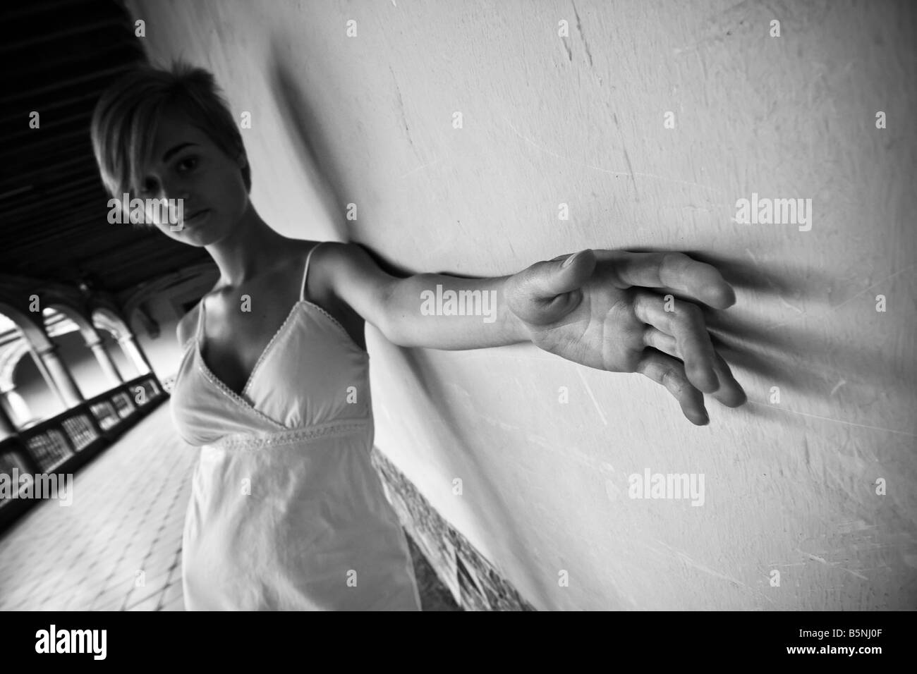 Young woman feeling alone in dark black and white tone Stock Photo