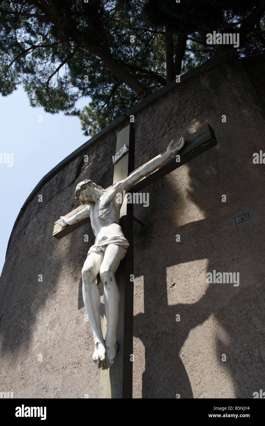 jesus on cross statue by street road in lazio italy Stock Photo - Alamy