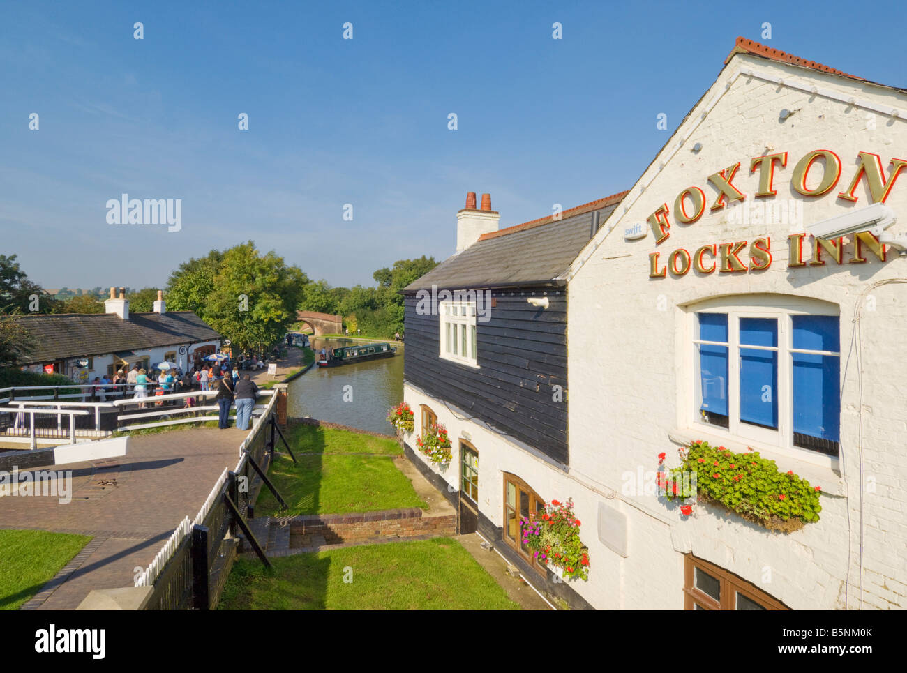 Foxton locks inn with barges and narrowboats Foxton Leicestershire England UK GB EU Europe Stock Photo