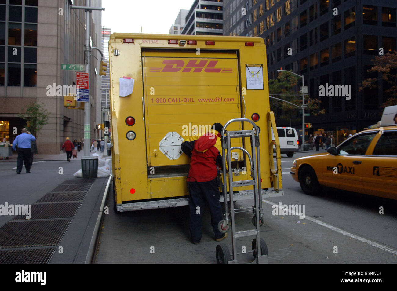 DHL trucks and couriers are seen in New York Stock Photo