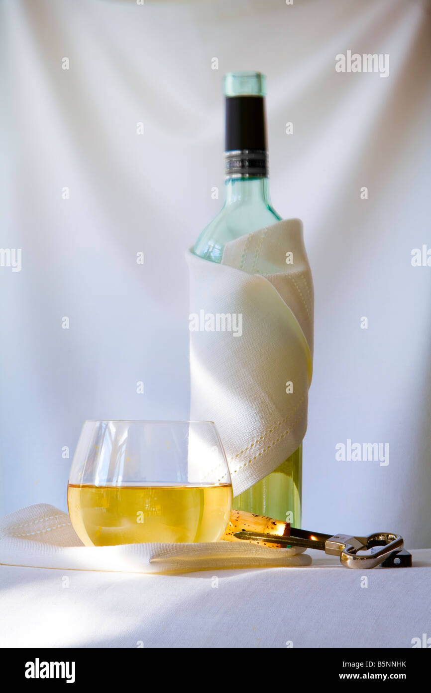 wine bottle and glass of white wine Stock Photo