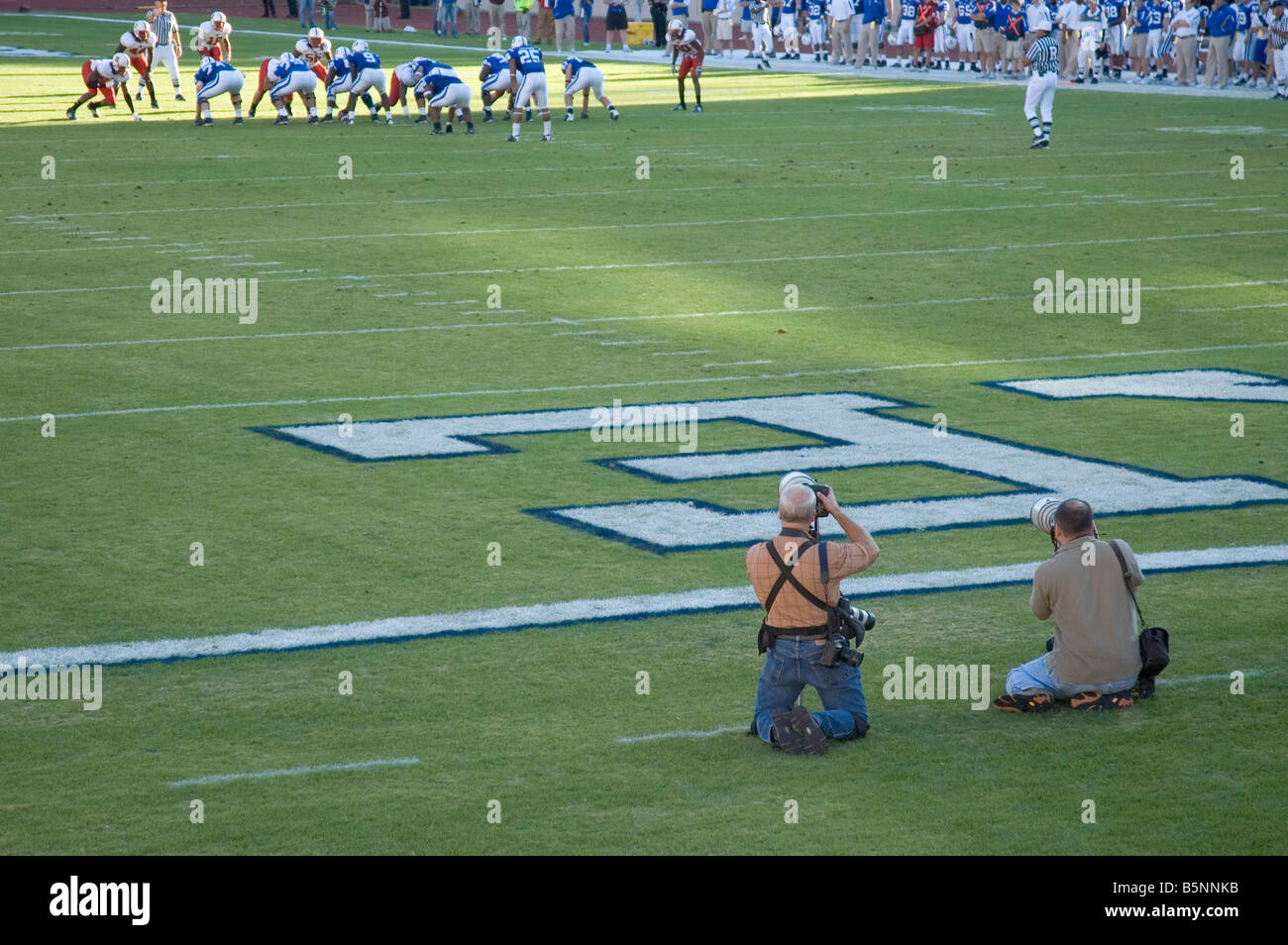 Photographers reporters taking photographs during a football game between Duke and North Carolina State University Stock Photo