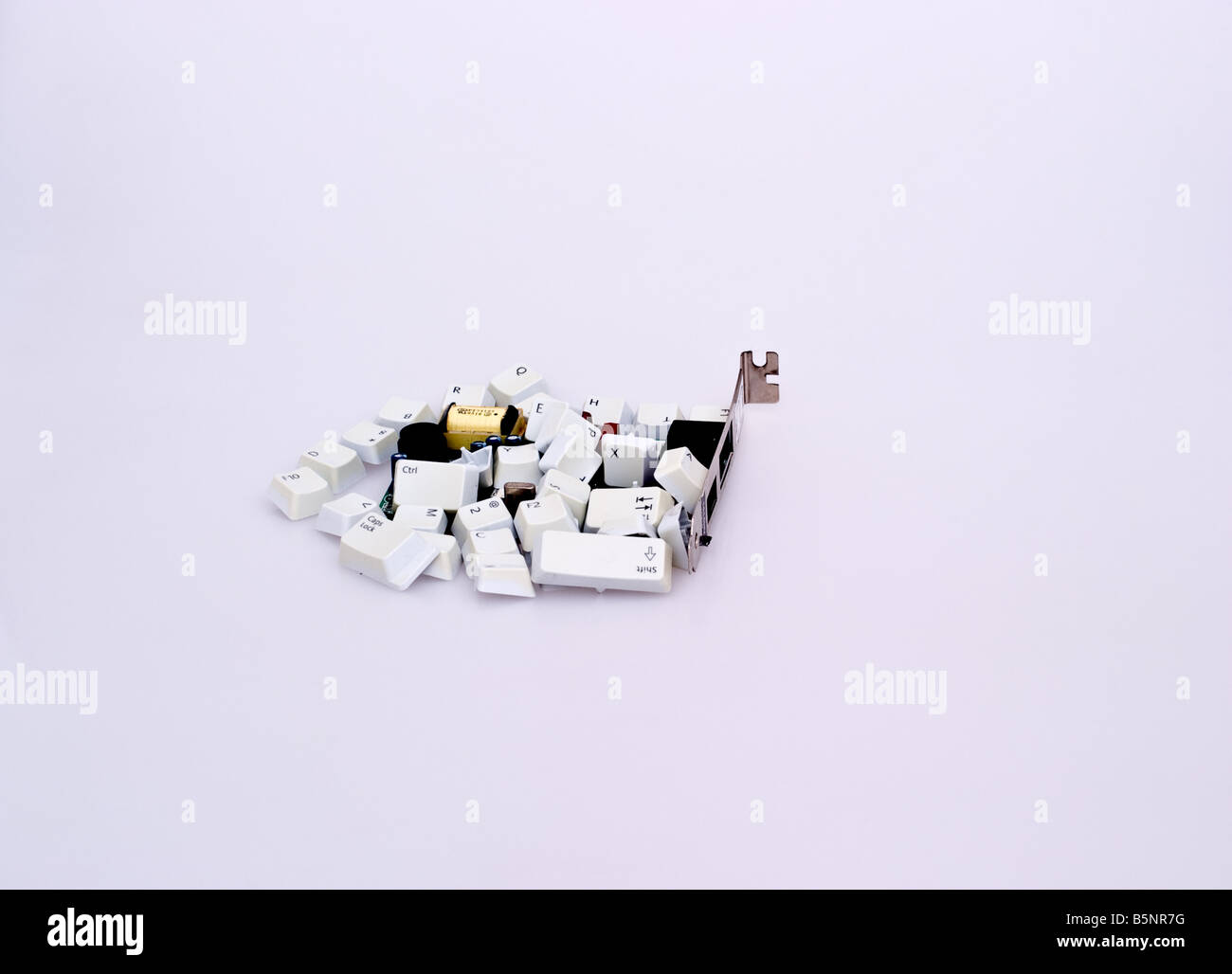 Computer modem card atop a pile of computer keys Stock Photo