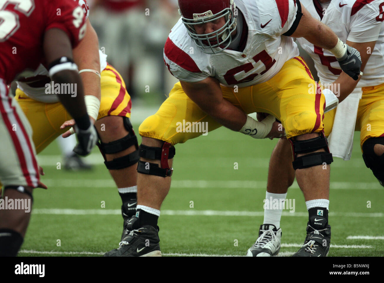 USC center, Kristofer O'Dowd (#61), hikes the ball to quarterback Mark Sanchez during a Pac-10 game against Washington State. Stock Photo