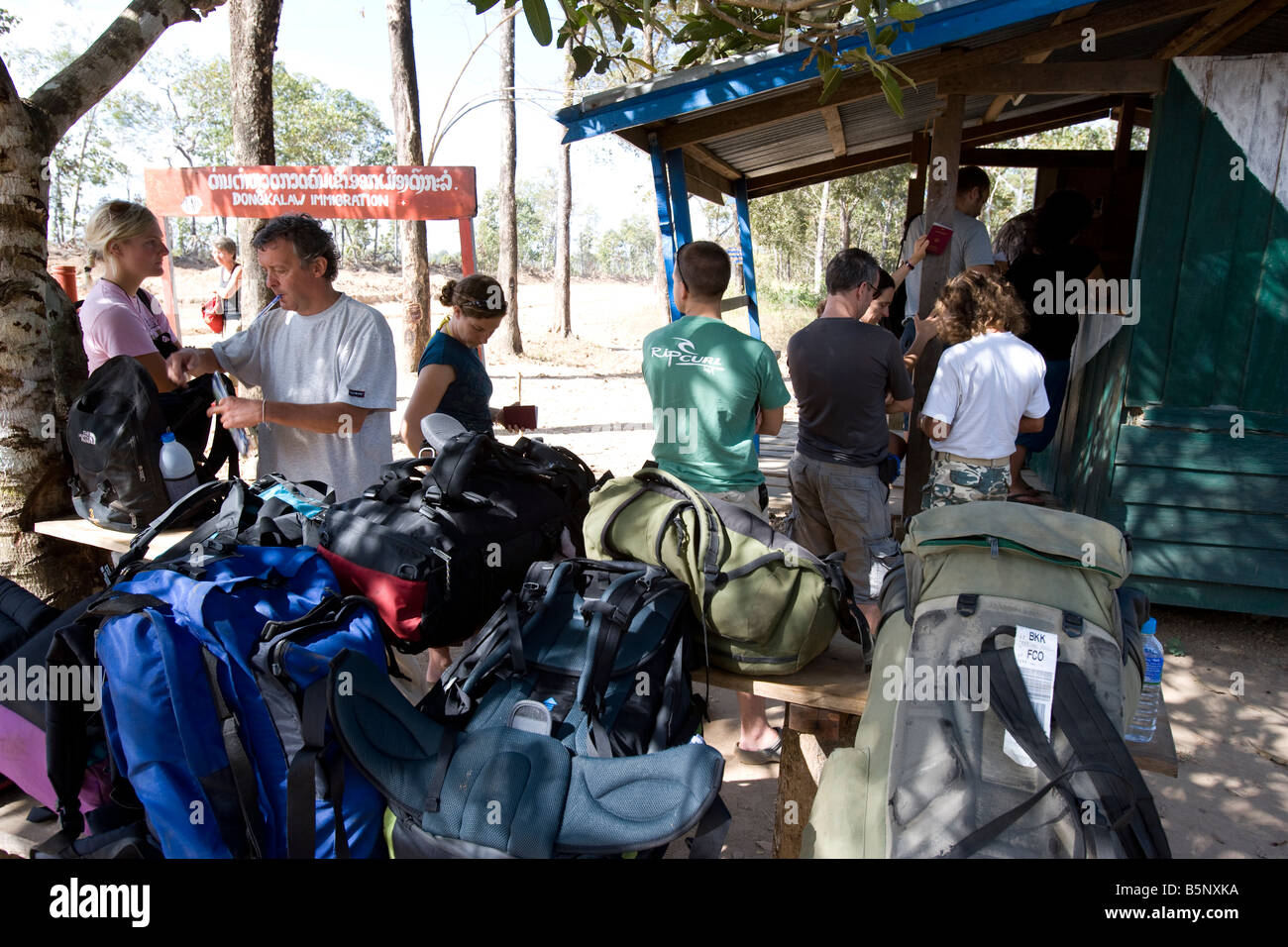 Travellers at the Laos border crossing into Cambodia at Voen Kham in southern Laos Stock Photo