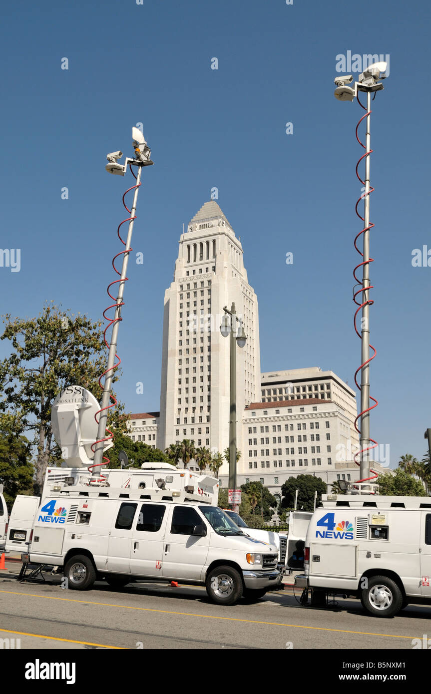 Media trucks stand parked on North Spring Street in downtown Los Angeles, California Stock Photo