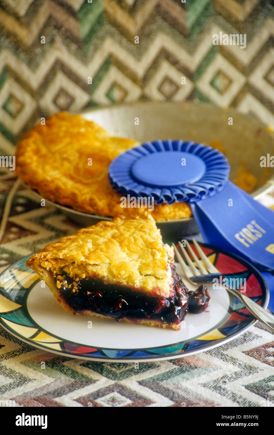 Slice or berry pie with first place blue ribbon Stock Photo Alamy
