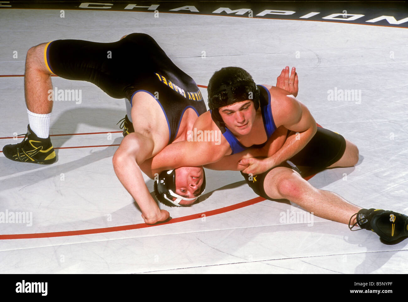 High school wrestlers during match Stock Photo