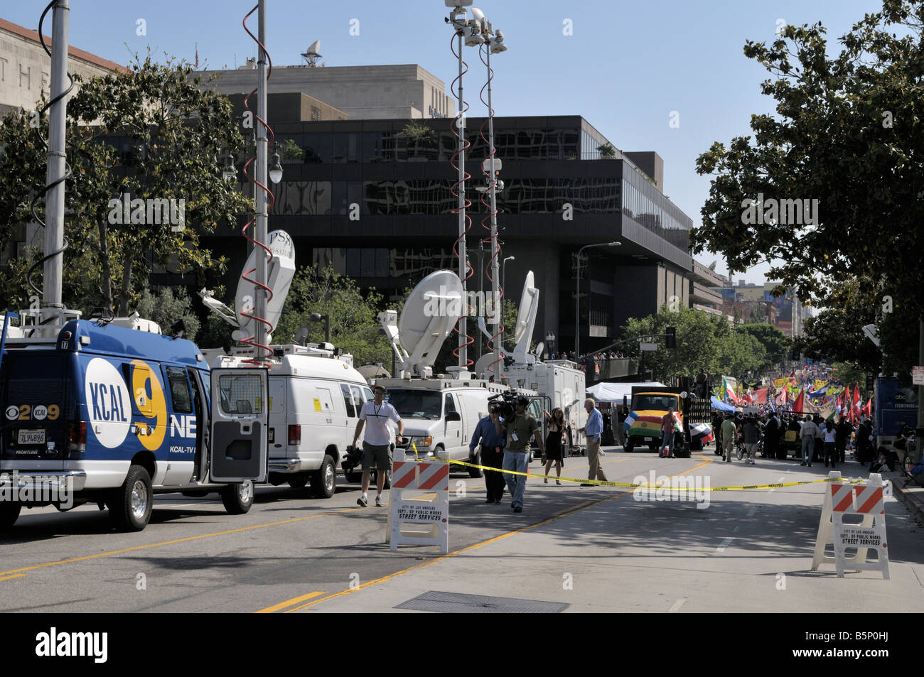 Police officers of the Los Angeles Police Department watch from a distance the ongoing May 1 demonstrations in Los Angeles Stock Photo
