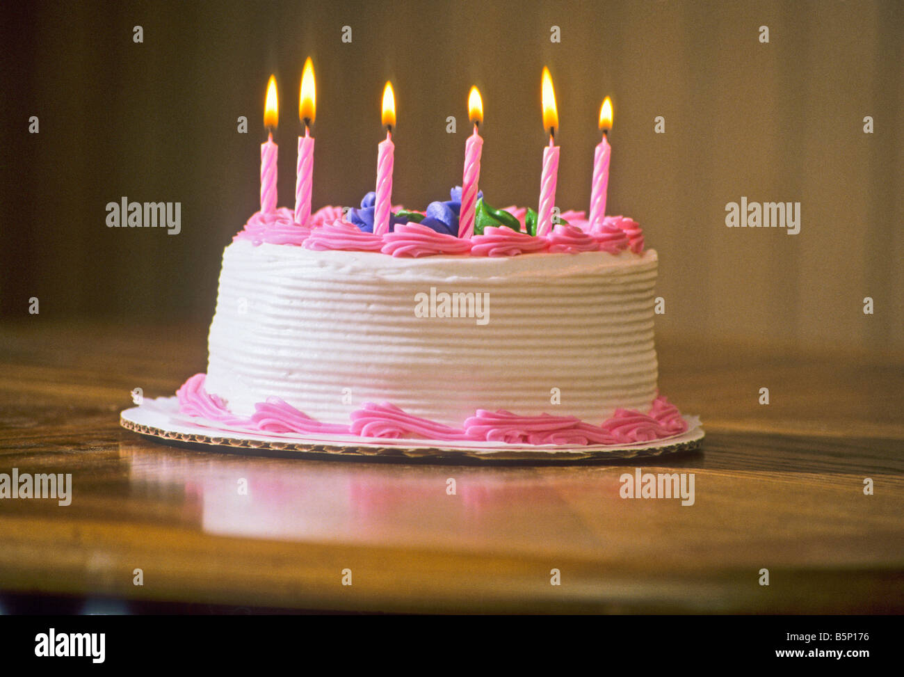 Birthday cake with candles burning Stock Photo Alamy
