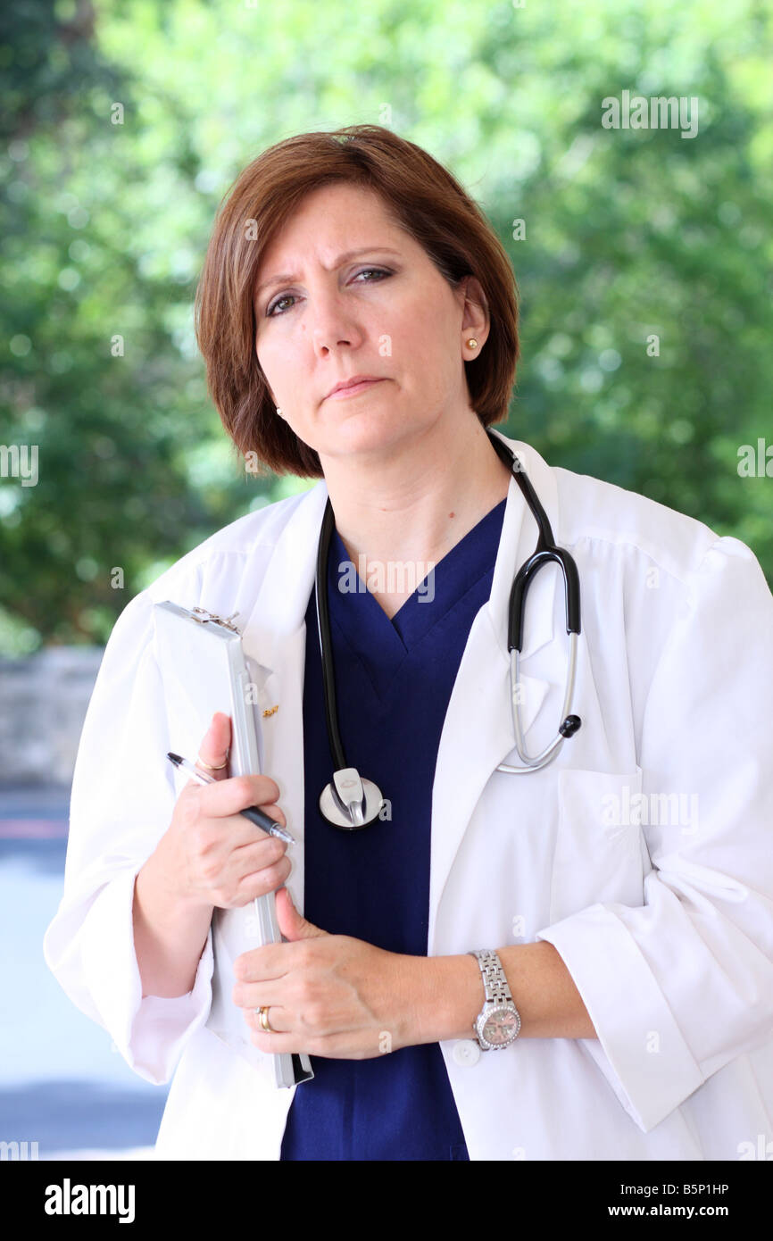 Registered Nurse with a clipboard looking at the camera Stock Photo