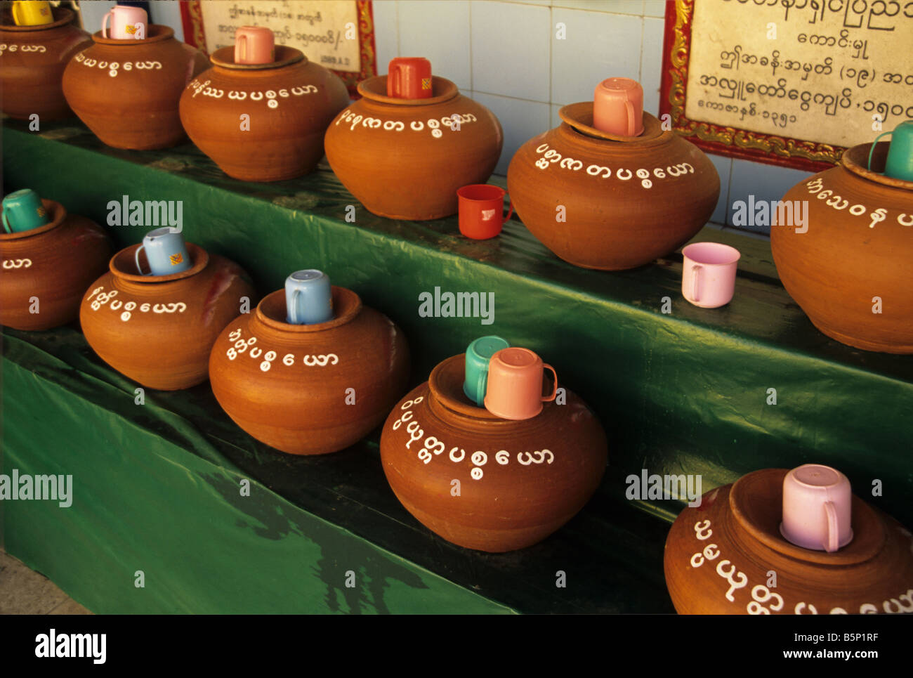 Terracotta Jars of Water at Sule Paya or Pagoda in central Rangoon or Yangon, Burma or Myanmar Stock Photo