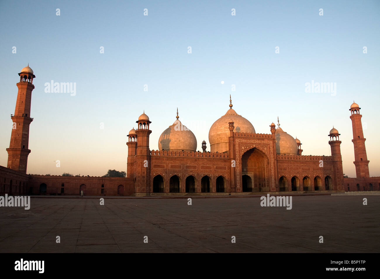 Badshai Mosque Early Morning Sunrise with Moon Overhead Lahore Pakistan