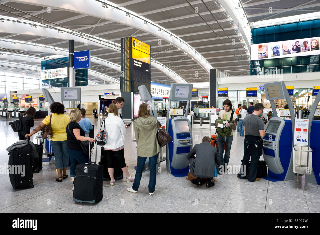 self check in, departure level, Terminal 5, Heathrow, London, England Stock Photo