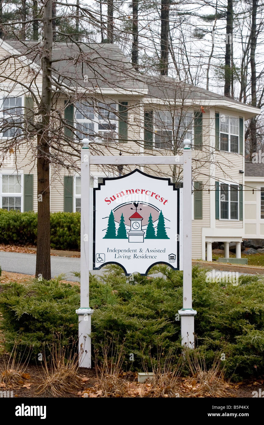 Assisted living sign with residence in background. Stock Photo