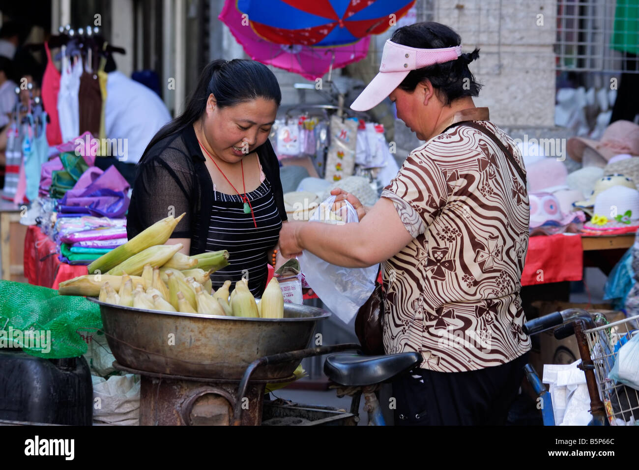 A Chinese woman selling her goods on a street market, HoHot, Inner Mongolia, northern China Stock Photo