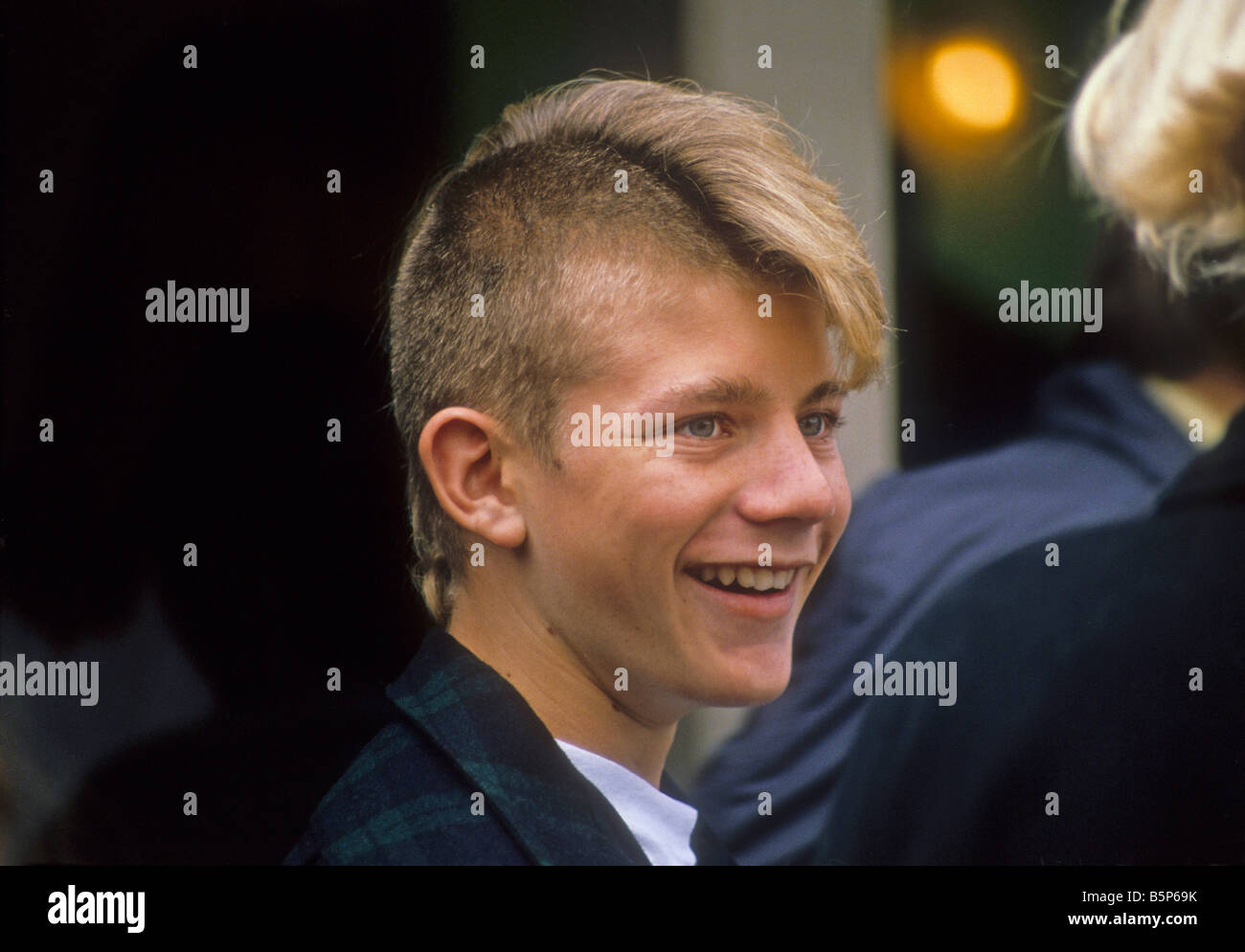 Outdoor portrait of teen boy with unusual haircut Stock Photo