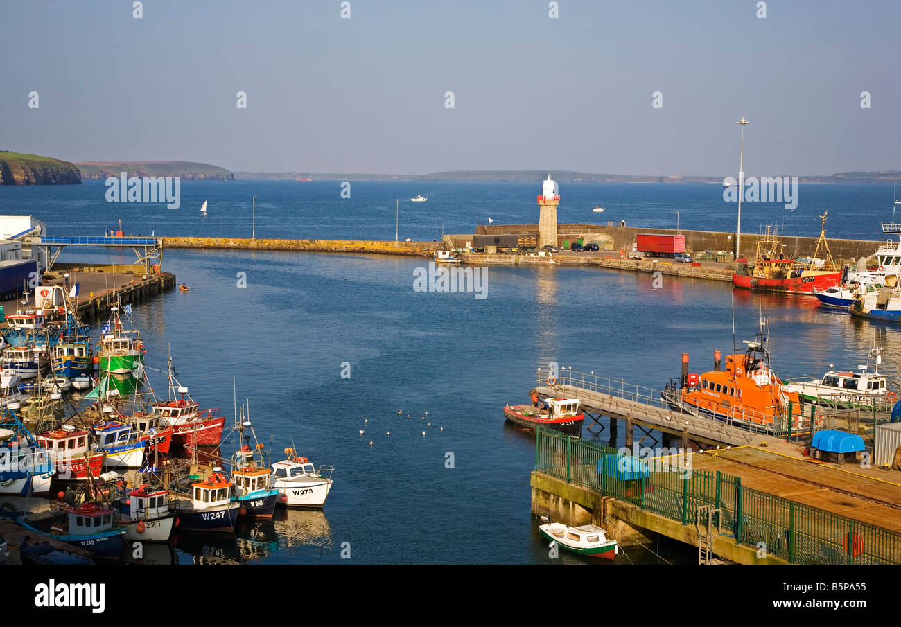 Fishing Boats at rest in the Harbour built in 1815 by Alexander Nimmo,, Dunmore East, County Waterford, Ireland Stock Photo
