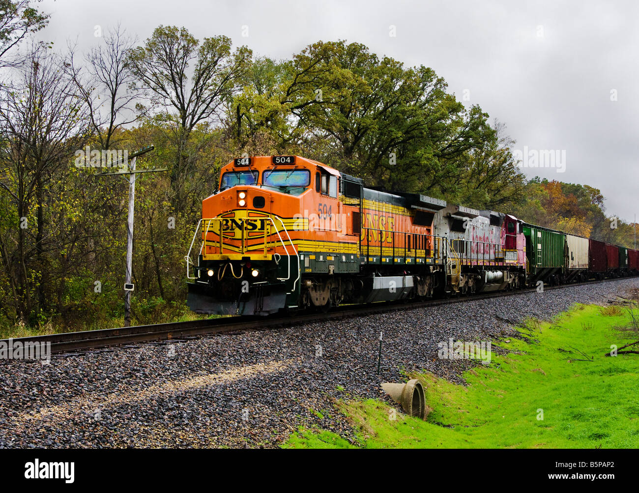 BNSF diesel locomotive pulls a load of cars towards Colona, IL. Stock Photo