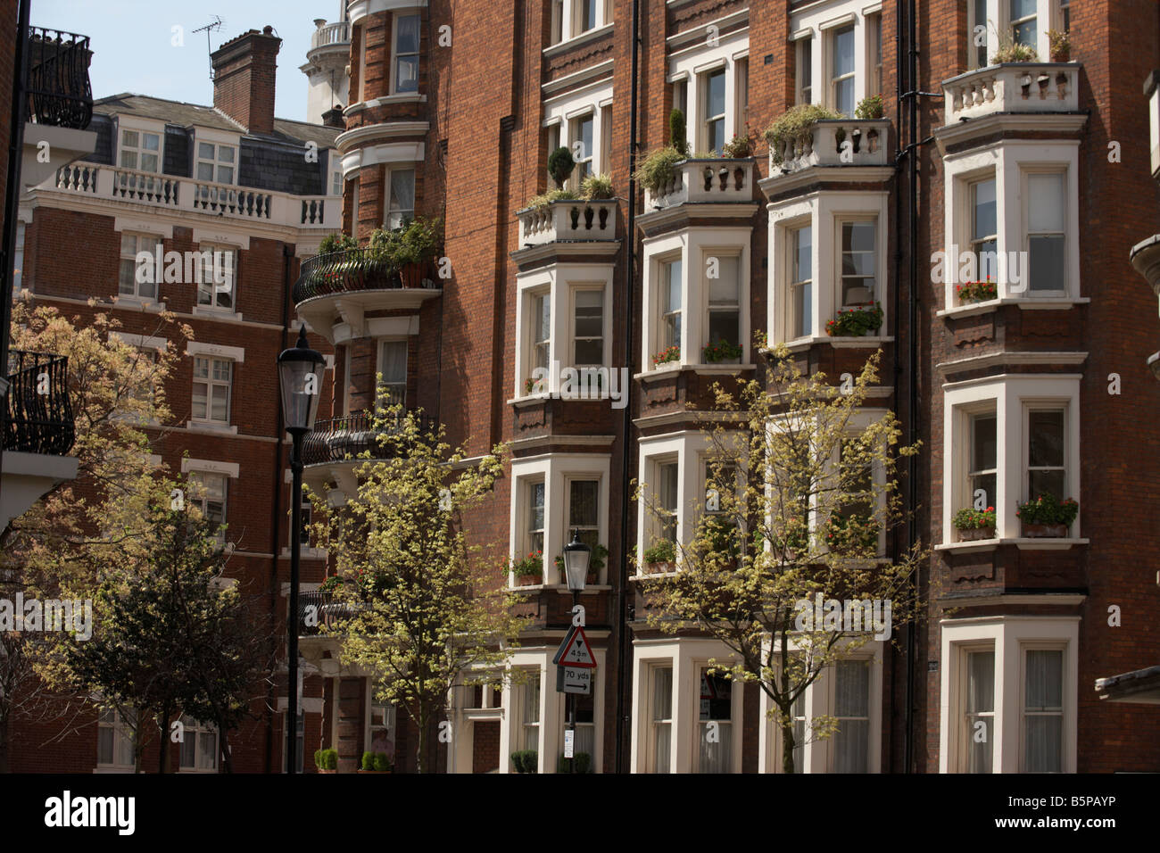 Handsome red brick architecture of Victorian properties in D'Oyley Street London's Belgravia, SW1 Stock Photo