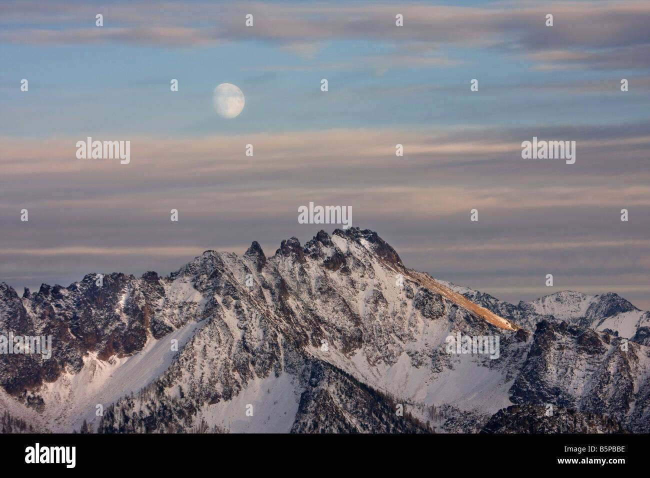 A nearly full moon over Silverstar Mountain near Washington Pass in the ...