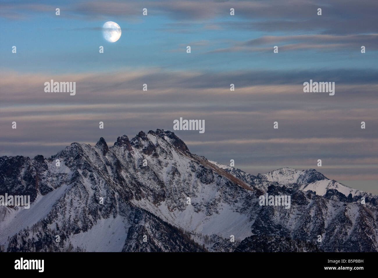 A nearly full moon over Silverstar Mountain near Washington Pass in the ...