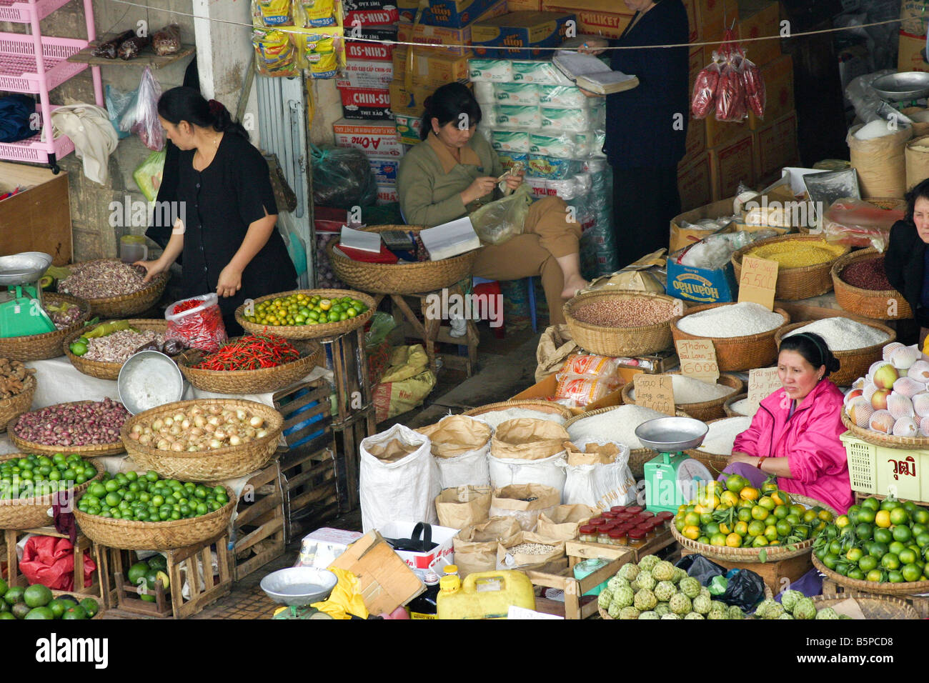 vegetables and fruits women sellers in big asian market at Dalat city, Vietnam Stock Photo