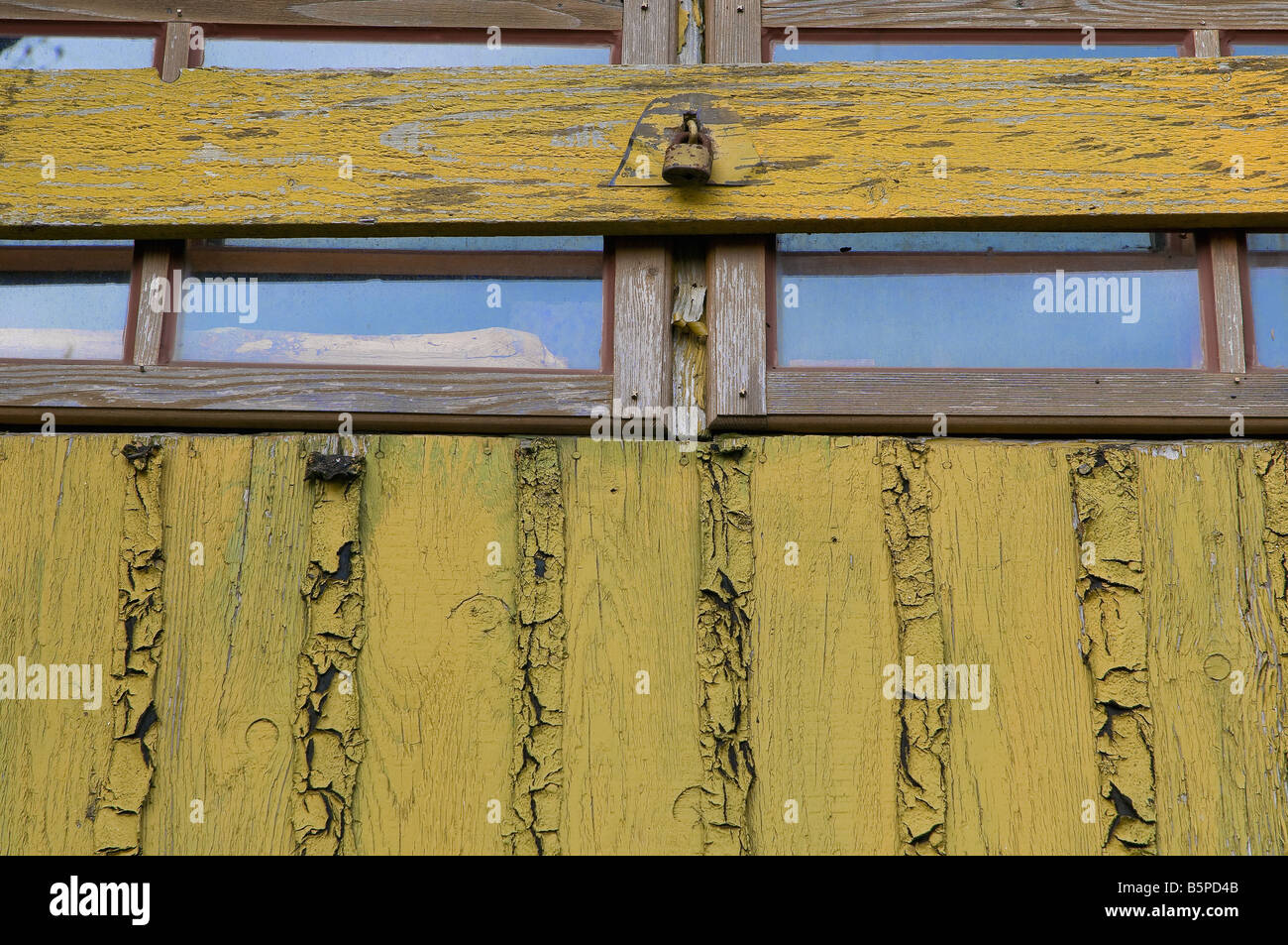 Old window with closed woody shutter and old rust padlock Stock Photo Alamy