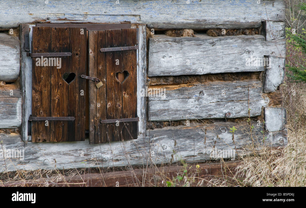 Old window with closed woody shutter and old rust padlock Stock Photo Alamy