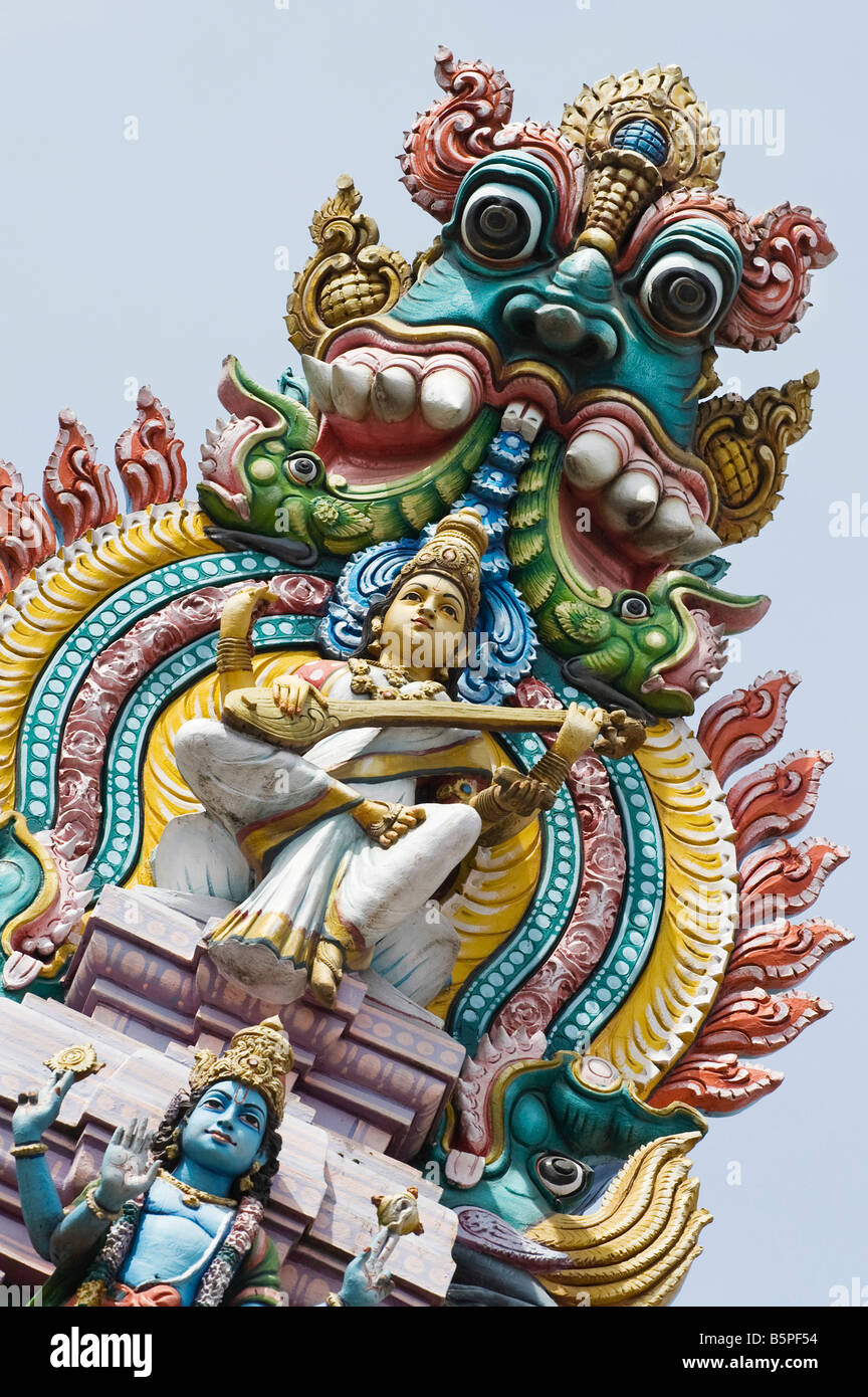 Hindu deities, painted statues, on a temple gopuram in Bangalore. India