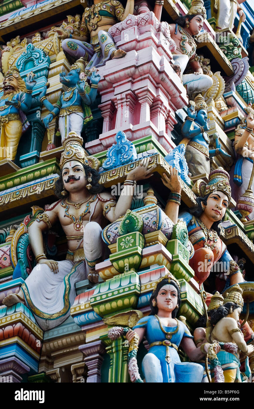 Hindu deities, painted statues, on a temple gopuram in Bangalore. India