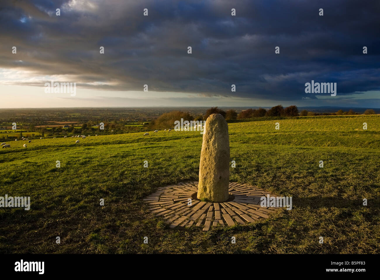The Lia Fail Standing Stone markS the graves of 37 people killed in the 1798 insurrection, Hill of Tara, County Meath, Ireland Stock Photo