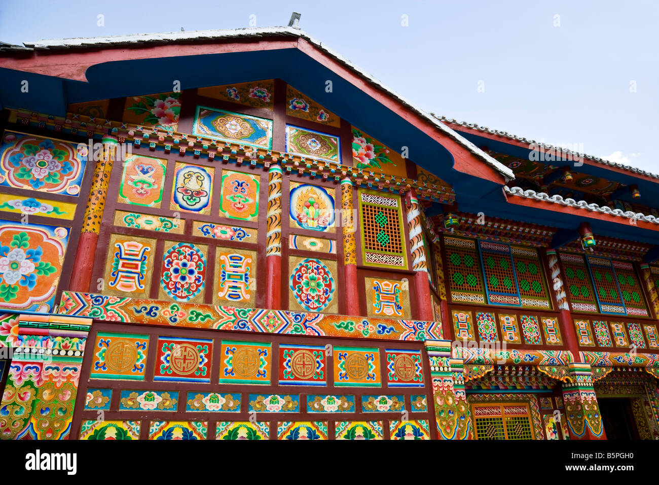 Brightly painted Tibetan tea house in Jiuzhaigou nature reserve Sichuan