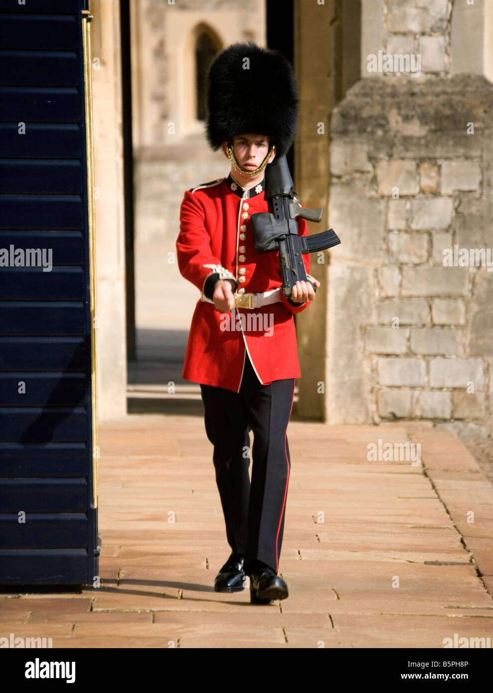 Queens Guard marching at Windsor Castle, United Kingdom Stock Photo