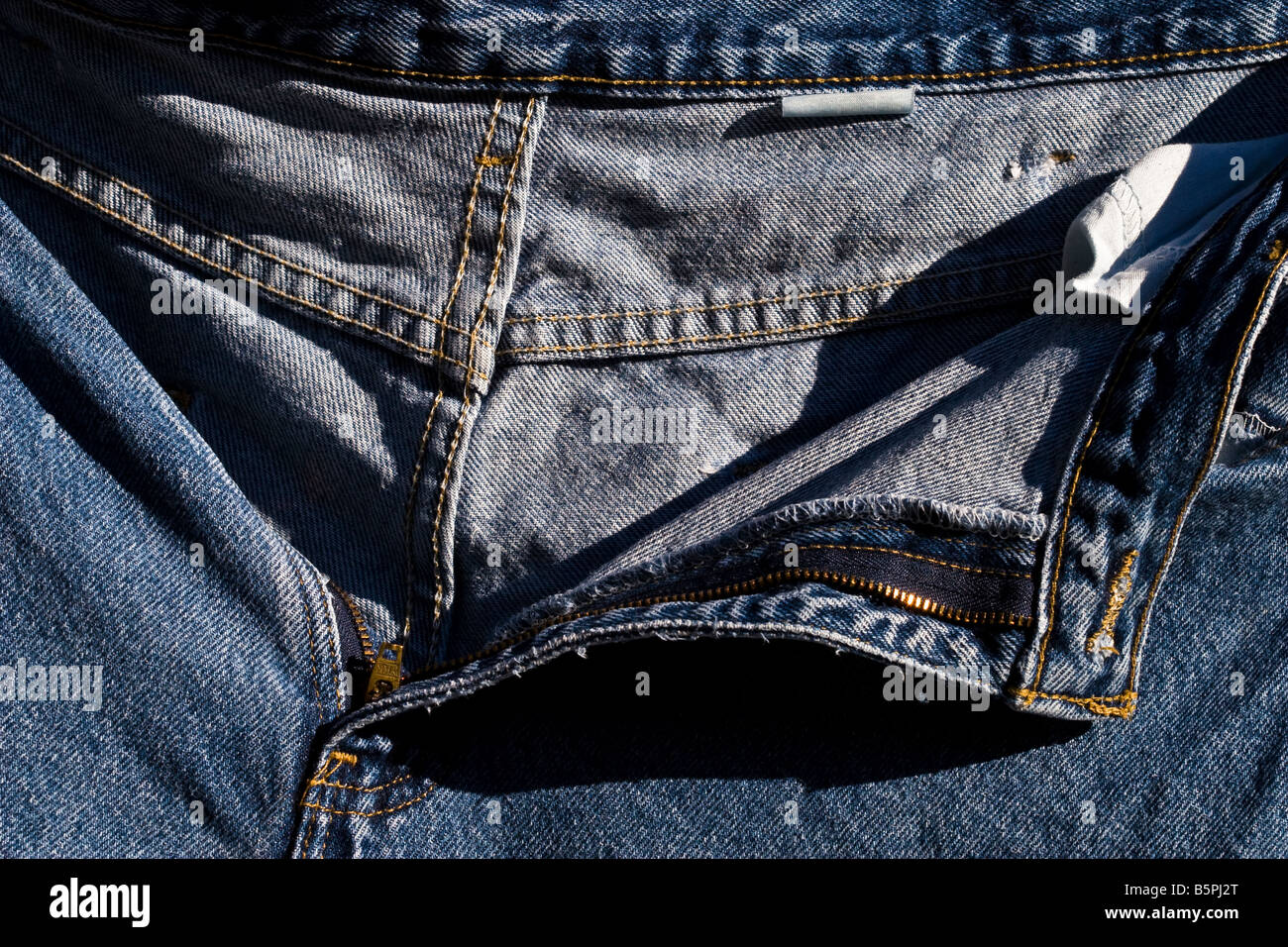 Detail of a blue jean zipper fly. Stock Photo