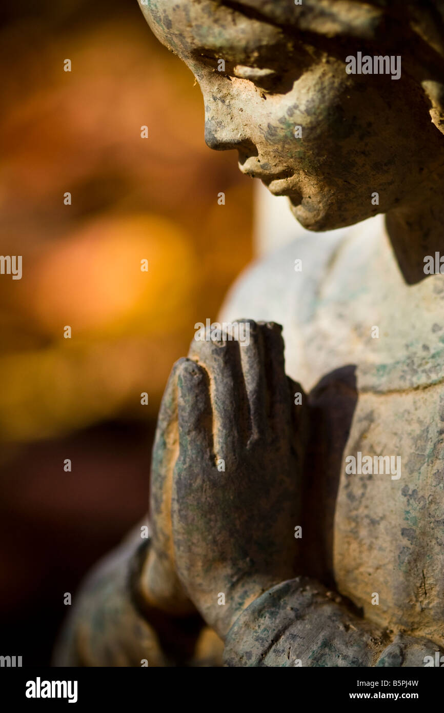 Praying hands a tombstone hi-res stock photography and images - Alamy