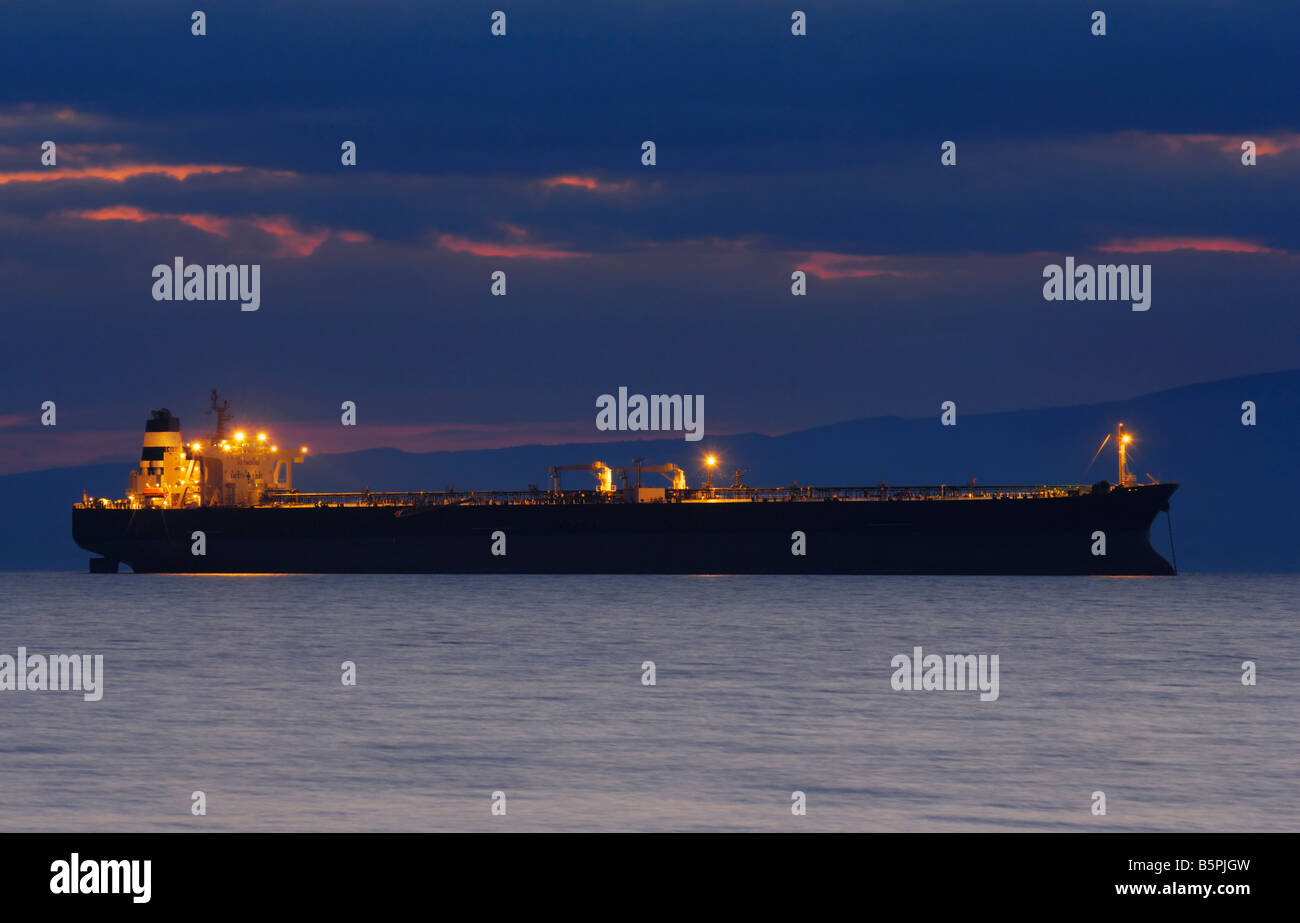 Commercial ship at dusk Stock Photo