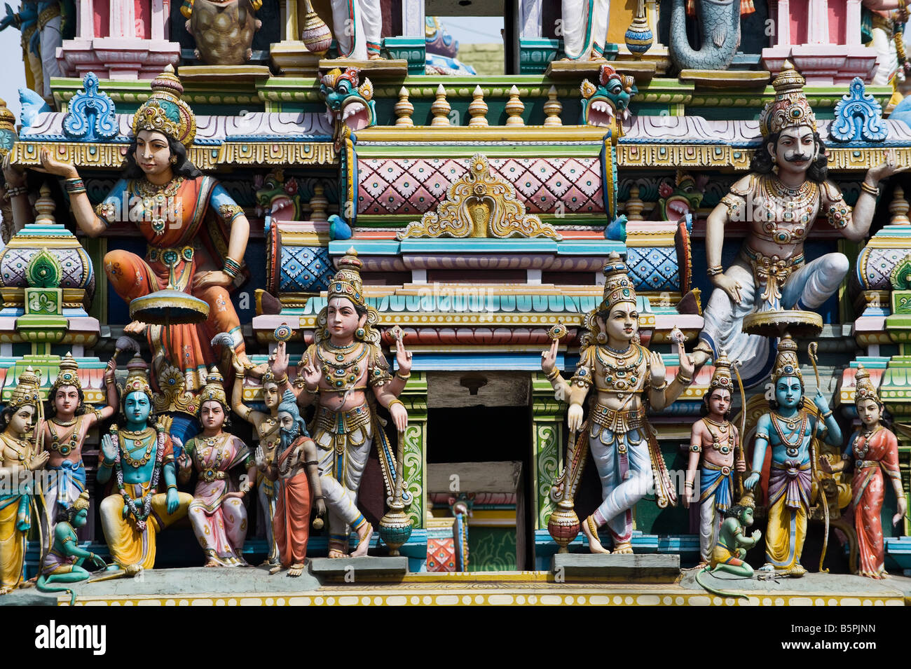 Hindu deities, painted statues, on a temple gopuram in Bangalore. India Stock Photo Alamy
